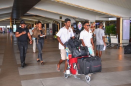 Tourists (L) pictured at Velana International Airport.