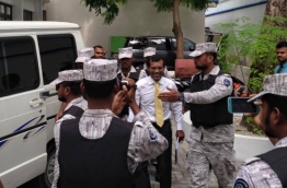 Former President Nasheed escorted to back to prison after being treated at ADK Hospital.