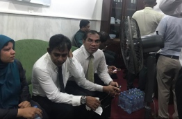 Thulusdhoo MP Mohamed Waheed Ibrahim (C) pictured inside the parliament administration with two other lawmakers after forcefully entering the building.
