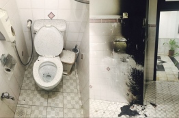 Blackened areas of the toilet cubicle where the fire broke out inside the parliament building