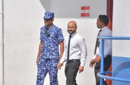 Dhiggaru MP Faris Maumoon on way to Dhoonidhoo Detention Centre after a hearing at the Criminal Court. PHOTO: HUSSAIN WAHEED/MIHAARU
