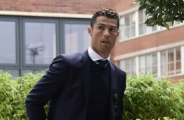 Real Madrid star Cristiano Ronaldo heads to court on July 30, 2017, accused of evading 14.7 million euros in tax through offshore companies in a country only just emerging from a damaging economic crisis. / AFP PHOTO / JAVIER SORIANO