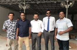 Senior officials of PPM pictured in front of the ruling party's new activity hub which is in development. PHOTO/TWITTER