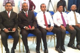 The now-suspended judge of the Criminal Court, Ahmed Rasheed (C).