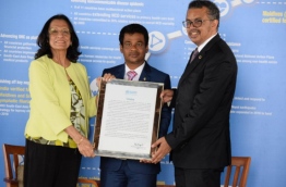 Health Minister Abdulla Nazim Ibrahim (C) receives WHO's award to the Maldives for the successful eradication of measles from the country. PHOTO/HEALTH MINISTRY