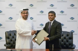 Ambassador of the Maldives to the UAE, Dr Hussain Niyaz, and ADFD’s Director General Mohamed Saif Al Suwaidi shake hands after signing the agreement for Abu Dhabi Fund to donate USD 500,000 to the Maldives for its developmental projects.