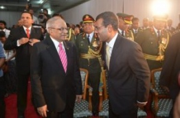 Former presidents Maumoon Abdul Gayoom (L) and Mohamed Nasheed at a function.