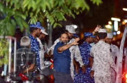 Adhaalath Party's leader Sheikh Imran being escorted by Maldives Correctional Service (MCS) officers after being transferred to temporary house arrest. MIHAARU PHOTO / NISHAN ALI