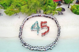Staff of Kurumba Maldives on the island's beach in formation of the number 45 during the celebrations held to mark the resort's 45th Anniversary. PHOTO / KURUMBA MALDIVES