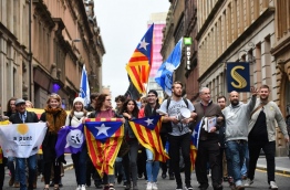 The Scottish National Party on October 10, 2017 urged the Spanish government to "respect the overwhelming 'si' vote" in the Catalan independence referendum in a resolution at its annual conference. / AFP PHOTO / ANDY BUCHANAN