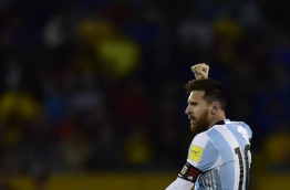 Argentina's Lionel Messi celebrates after scoring his third goal against Ecuador during their 2018 World Cup qualifier football match in Quito, on October 10, 2017. / AFP PHOTO / Rodrigo BUENDIA