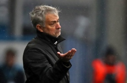 Manchester United's Portuguese manager Jose Mourinho gestures on the touchline during the English Premier League football match between Huddersfield Town and Manchester United at the John Smith's stadium in Huddersfield, northern England on October 21, 2017. / AFP PHOTO / Lindsey PARNABY / RESTRICTED TO EDITORIAL USE. No use with unauthorized audio, video, data, fixture lists, club/league logos or 'live' services. Online in-match use limited to 75 images, no video emulation. No use in betting, games or single club/league/player publications. /