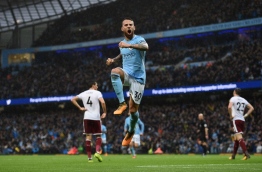 Manchester City's Argentinian defender Nicolas Otamendi celebrates scoring his team's second goal during the English Premier League football match between Manchester City and Burnley at the Etihad Stadium in Manchester, north west England, on October 21, 2017. / AFP PHOTO / Oli SCARFF / RESTRICTED TO EDITORIAL USE. No use with unauthorized audio, video, data, fixture lists, club/league logos or 'live' services. Online in-match use limited to 75 images, no video emulation. No use in betting, games or single club/league/player publications. /
