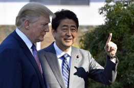 Trump touched down in Japan, kicking off the first leg of a high-stakes Asia tour set to be dominated by soaring tensions with nuclear-armed North Korea. / AFP PHOTO / POOL / FRANCK ROBICHON