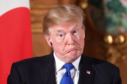 Trump lashed out at the US trade relationship with Japan, saying it was "not fair and open", as he prepared for formal talks with his Japanese counterpart. / AFP PHOTO / Jim WATSON