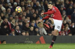 Manchester United's Swedish striker Zlatan Ibrahimovic plays the ball during the English Premier League football match between Manchester United and Newcastle at Old Trafford in Manchester, north west England, on November 18, 2017. / AFP PHOTO / Oli SCARFF / RESTRICTED TO EDITORIAL USE. No use with unauthorized audio, video, data, fixture lists, club/league logos or 'live' services. Online in-match use limited to 75 images, no video emulation. No use in betting, games or single club/league/player publications. /