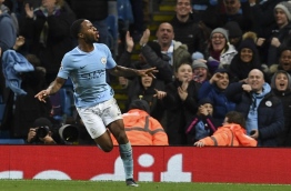 Manchester City's English midfielder Raheem Sterling celebrates scoring the opening goal during the UEFA Champions League Group F football match between Manchester City and Feyenoord at the Etihad Stadium in Manchester, north west England, on November 21, 2017. / AFP PHOTO / Paul ELLIS
