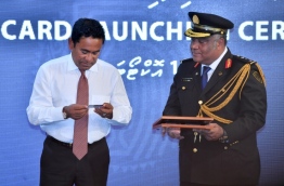 President Abdulla Yameen (L) launches the new Maldivian passport card. PHOTO/PRESIDENT'S OFFICE