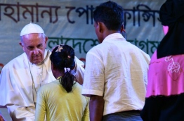 Pope Francis arrived in Bangladesh from Myanmar on November 30 for the second stage of a visit that has been overshadowed by the plight of hundreds of thousands of Rohingya refugees. / AFP PHOTO / Vincenzo PINTO