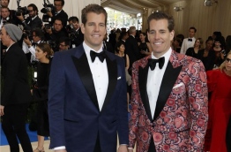 Tyler and Cameron Winklevoss - the Harvard University twins who famously sued Mark Zuckerberg claiming he stole their idea for Facebook - have become the world's first bitcoin billionaires. PHOTO: REUTERS