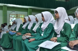 Students of Arabiyya School pictured with their final report cards. PHOTO: HUSSAIN WAHEED/MIHAARU