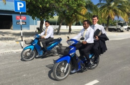 British Ambassador James Dauris pictured riding a motorbike with some local councillors during his visit to GDh Thinadhoo. PHOTO/JAMES DAURIS TWITTER