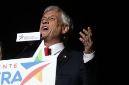 Conservative billionaire Sebastian Pinera will return as Chile's president, the election results show. His rival, leftist challenger Alejandro Guillier, a TV presenter turned senator who ran as an independent but was backed by outgoing center-left President Michelle Bachelet, recognized his defeat. / AFP PHOTO / CLAUDIO REYES