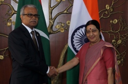 Maldives' foreign minister Dr Mohamed Asim (L) meets Indian foreign minister Sushma Swaraj.