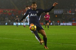 Tottenham Hotspur's Spanish striker Fernando Llorente controls the ball during the English Premier League football match between Swansea City and Tottenham Hotspur at The Liberty Stadium in Swansea, south Wales on January 2, 2018. / AFP PHOTO / Geoff CADDICK / RESTRICTED TO EDITORIAL USE. No use with unauthorized audio, video, data, fixture lists, club/league logos or 'live' services. Online in-match use limited to 75 images, no video emulation. No use in betting, games or single club/league/player publications. /