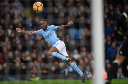Manchester City's English midfielder Raheem Sterling heads wide during the English Premier League football match between Manchester City and Watford at the Etihad Stadium in Manchester, north west England, on January 2, 2018. / AFP PHOTO / Paul ELLIS / RESTRICTED TO EDITORIAL USE. No use with unauthorized audio, video, data, fixture lists, club/league logos or 'live' services. Online in-match use limited to 75 images, no video emulation. No use in betting, games or single club/league/player publications. /
