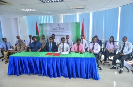 Officials of the Maldives' health ministry and India's NIMS Hospital at the signing ceremony awarding operations and development of Kulhudhuffushi Regional Hospital to the latter. PHOTO: HUSSAIN WAHEED/MIHAARU