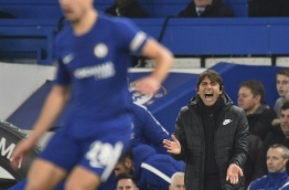 Chelsea's Italian head coach Antonio Conte gestures on the touchline during the English Premier League football match between Chelsea and Leicester City at Stamford Bridge in London on January 13, 2018. / AFP PHOTO / Glyn KIRK / RESTRICTED TO EDITORIAL USE. No use with unauthorized audio, video, data, fixture lists, club/league logos or 'live' services. Online in-match use limited to 75 images, no video emulation. No use in betting, games or single club/league/player publications. /
