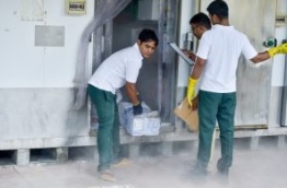 Sun Island Resort's staff take out stored products from the resort's cold storage. FILE PHOTO: NISHAN ALI/MIHAARU