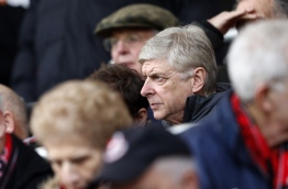 Arsenal's French manager Arsene Wenger looks on from the stands before the English Premier League football match between Bournemouth and Arsenal at the Vitality Stadium in Bournemouth, southern England on January 14, 2018. / AFP PHOTO / Adrian DENNIS / RESTRICTED TO EDITORIAL USE. No use with unauthorized audio, video, data, fixture lists, club/league logos or 'live' services. Online in-match use limited to 75 images, no video emulation. No use in betting, games or single club/league/player publications. /