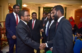 President of the Judges' Association Shuaib Hussain Zakariyya (L) shaking hands with attendees in a ceremony. PHOTO: NISHAN ALI/ MIHAARU