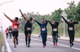 Participants of TFG's "Run in Laamu" do the 'dab dance' as they run along Laamu atoll's scenic route. PHOTO/TFG