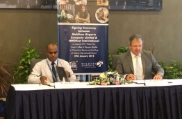 HMSHost CEO Walter Seib and MACL MD Aadil Moosa signing the agreement to develop KFC and Pizza Hut franchises.
