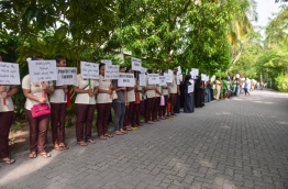 Employees of a resort, operated under Villa, protest against raids. PHOTO: HUSSAIN WAHEED/MIHAARU