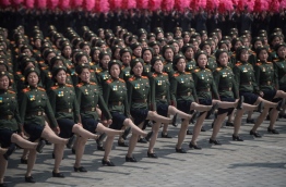 North Korea's planned military parade on the eve of the South's Winter Olympics is a carefully calculated move to use the global spotlight on the peninsula to reassert its military power, analysts say. / AFP PHOTO / Ed JONES / TO GO WITH NKorea-SKorea-politics-Oly-diplomacy,FOCUS