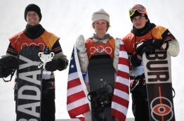 Silver medallist Canada's Max Parrot, gold medallist US Redmond Gerard and bronze medallist Canada's Mark McMorris celebrate during the victory ceremony at the end of the men's snowboard slopestyle final at the Phoenix Park during the Pyeongchang 2018 Winter Olympic Games on February 11, 2018 in Pyeongchang. / AFP PHOTO / Martin BUREAU