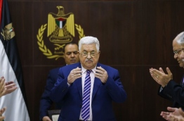 Palestinian president Mahmoud Abbas recites a prayer prior to chairing a meeting of the Palestine Liberation Organization (PLO) Executive Committee at the Palestinian Authority headquarters in the West Bank city of Ramallah on February 3, 2018, discussing recommendations to suspend the PLO's recognition of Israel in response to US President Donald Trump's declaration of Jerusalem as Israel's capital. / AFP PHOTO / ABBAS MOMANI
