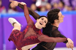 Canada's Tessa Virtue and Canada's Scott Moir compete in the figure skating team event ice dance free dance during the Pyeongchang 2018 Winter Olympic Games at the Gangneung Ice Arena in Gangneung on February 12, 2018. / AFP PHOTO / Mladen ANTONOV