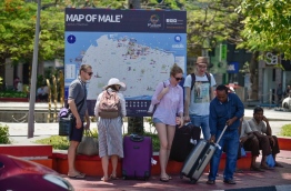 A group of tourists pictured outside the Republic Square in Male. PHOTO: HUSSAIN WAHEED/MIHAARU