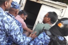 MP Abdullah "Abulhoa" Mohamed being taken in the police jeep by the riot police on February 23, 2018. --
