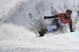Czech Republic's Ester Ledecka competes to win the big final of the women's snowboard parallel giant slalom event at the Phoenix Park during the Pyeongchang 2018 Winter Olympic Games on February 24, 2018 in Pyeongchang. / AFP PHOTO / Martin BUREAU