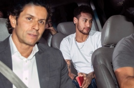 Brazilian superstar Neymar arrived in Belo Horizonte later Friday for surgery to mend a broken bone in his right foot, while an anxious footballing nation wondered if its World Cup build-up will also need urgent care. / AFP PHOTO / NELSON ALMEIDA