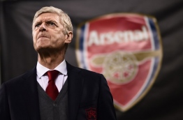 Arsenal's coach Arsene Wenger from France looks on during the UEFA Europa League round of 16 first-leg football match AC Milan Vs Arsenal at the 'San Siro Stadium' in Milan on March 8, 2018. / AFP PHOTO / MARCO BERTORELLO