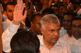 Sri Lanka's Prime Minister Ranil Wickremesinghe faced a no-confidence motion on Wednesday that has widened a rift in the ruling coalition and worsened political turmoil in the island nation. / AFP PHOTO / LAKRUWAN WANNIARACHCHI