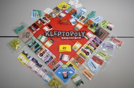 "Kleptopoly", a Malaysian board game based on "Monopoly", is poking fun at a massive financial scandal ahead of elections, featuring a motley crew of figures central to the controversy and items allegedly bought with looted money. / AFP PHOTO / Mohd RASFAN / TO GO WITH Malaysia-politics-corruption-game