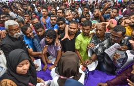 People gathered inside the Housing Ministry to pick up application forms for the social housing scheme 'Hiyaa Project'. PHOTO: NISHAN ALI/MIHAARU